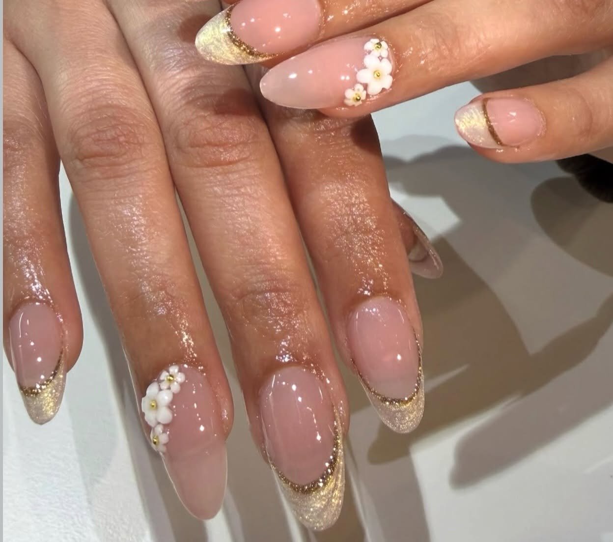 Gold French tips with 3D flowers